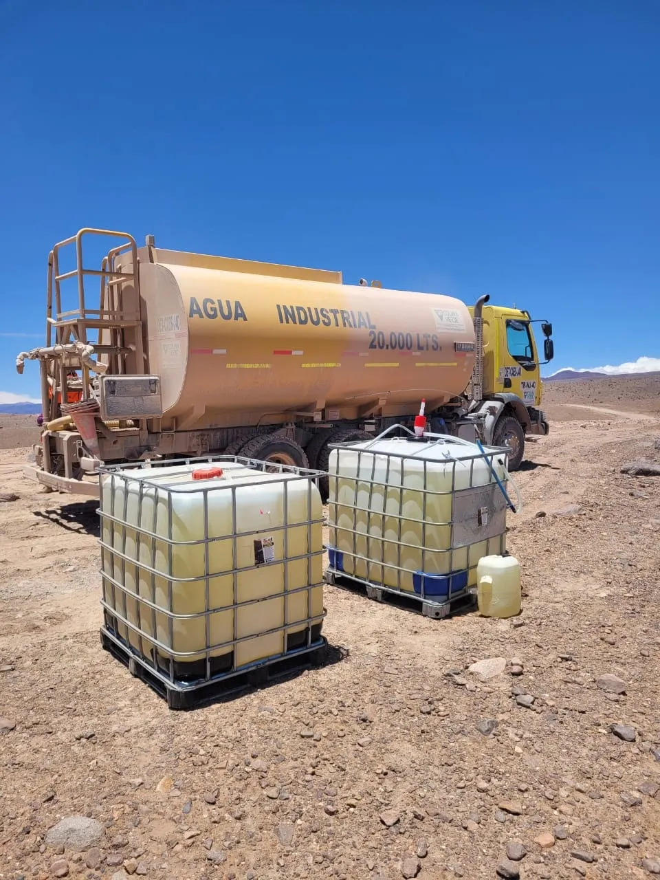 Water truck and NANO MC6 totes ready for application on a mine road